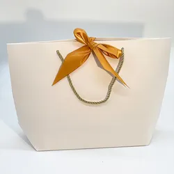 Customised Nice Handle Paper Bag with Logo Card Paper Purse Cosmetics Shopping Trapezoid Unique Packaging Gift Bags Ribbon