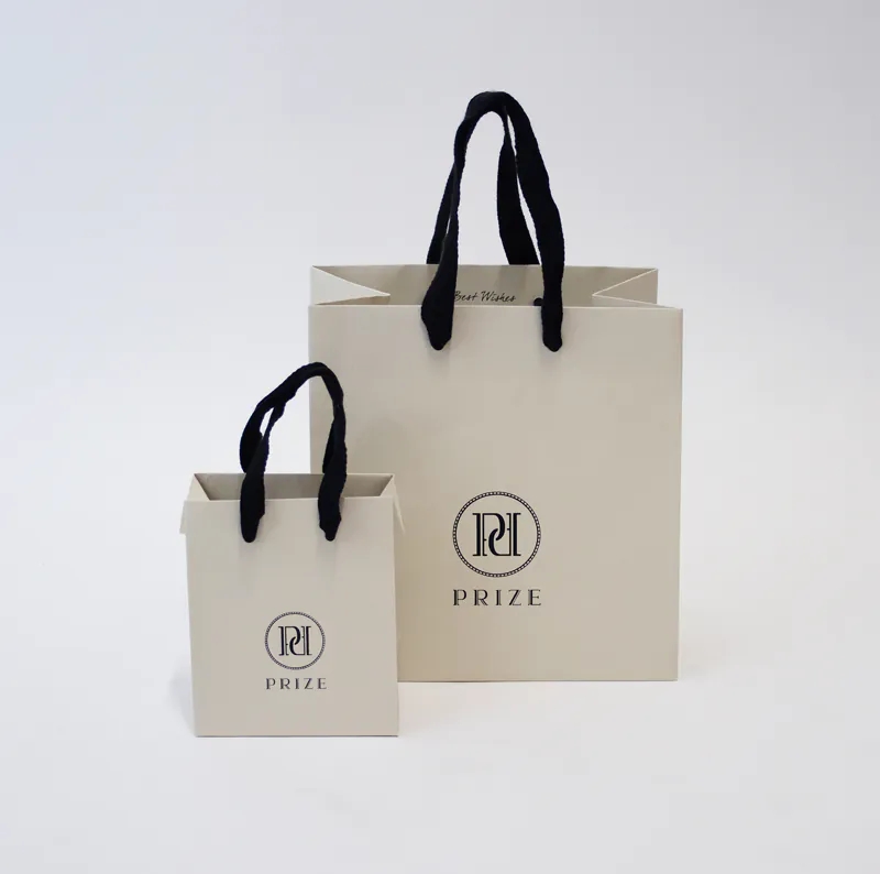 Wholesale Luxury Branded Bags Washable Christmas Gift Mini Kraft Paper Bag With Handle With Printing For Clothes